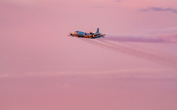 P3C Orion flies at dusk