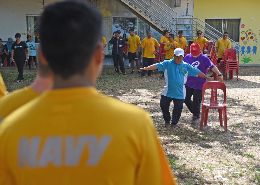 USS Blue Ridge/C7F team participates in a community relations event at the Seri Mengasih Center in Kota Kinabalu, Malaysia
