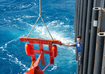 U.S. Sailor steadies a Larne target