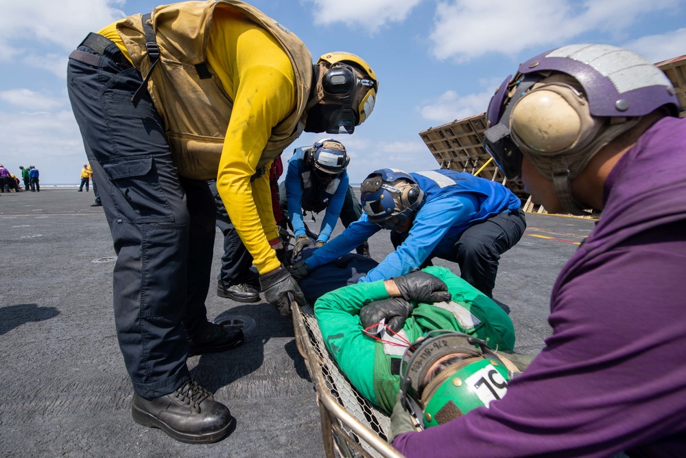 U.S. Sailors participate in a mass casualty drill