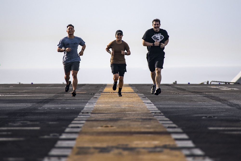 Sailors Run on the Flight Deck of the Kearsarge