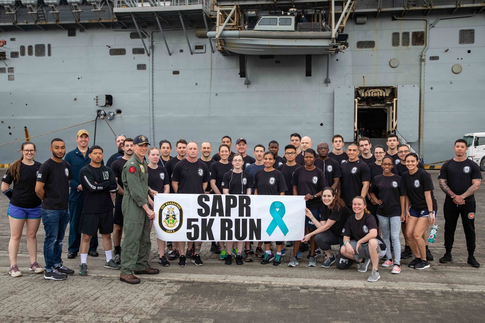 Sailors pose for a SAPR 5K Run group photo