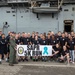 Sailors pose for a SAPR 5K Run group photo