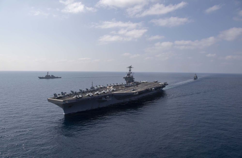 The aircraft carrier USS John C. Stennis (CVN 74), the guided-missile destroyer USS McFaul (DDG 74), and the guided-missile cruiser USS Mobile Bay (CG 53) sail in formation