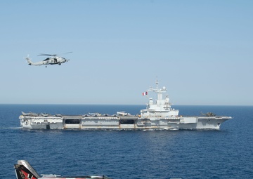 The Charles de Gaulle Carrier Strike Group and the John C. Stennis Carrier Strike Group conduct operations at sea