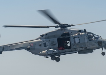 The Charles de Gaulle Carrier Strike Group and the John C. Stennis Carrier Strike Group conduct operations at sea