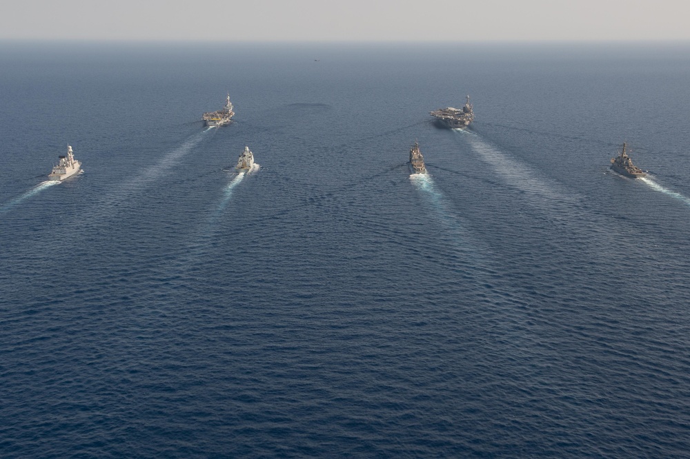 The Charles de Gaulle Carrier Strike Group and the John C. Stennis Carrier Strike Group conduct operations at sea