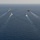 The Charles de Gaulle Carrier Strike Group and the John C. Stennis Carrier Strike Group conduct operations at sea