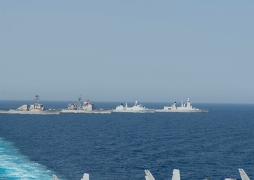 The Charles de Gaulle Carrier Strike Group and the John C. Stennis Carrier Strike Group conduct operations at sea