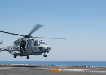 The Charles de Gaulle Carrier Strike Group and the John C. Stennis Carrier Strike Group conduct operations at sea