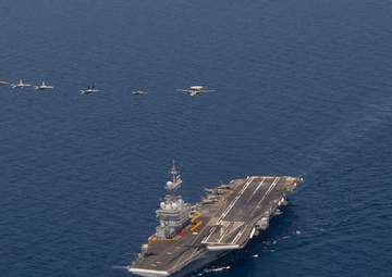 The Charles de Gaulle Carrier Strike Group and the John C. Stennis Carrier Strike Group conduct operations at sea