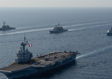 The Charles de Gaulle Carrier Strike Group and the John C. Stennis Carrier Strike Group conduct operations at sea