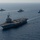 The Charles de Gaulle Carrier Strike Group and the John C. Stennis Carrier Strike Group conduct operations at sea