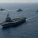 The Charles de Gaulle Carrier Strike Group and the John C. Stennis Carrier Strike Group conduct operations at sea