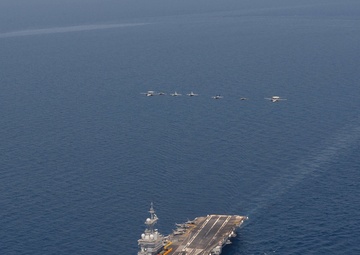 The Charles de Gaulle Carrier Strike Group and the John C. Stennis Carrier Strike Group conduct operations at sea