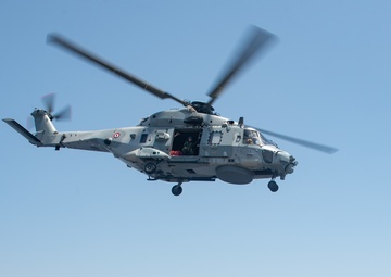 The Charles de Gaulle Carrier Strike Group and the John C. Stennis Carrier Strike Group conduct operations at sea