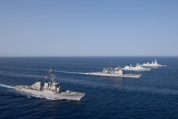 The Charles de Gaulle Carrier Strike Group and the John C. Stennis Carrier Strike Group conduct operations at sea
