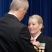 Capt. Lynn Bailey assigned to Navy Medicine West is awarded the Meritorious Service Medal