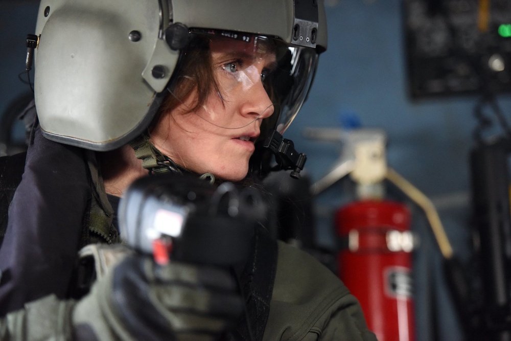 Coast Guard Air Station Elizabeth City crew test equipment during training flight over North Carolina coast