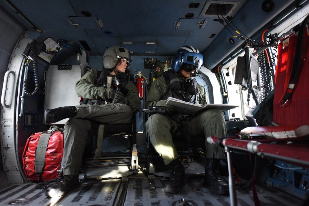 Coast Guard Air Station Elizabeth City crew test equipment during training flight over North Carolina coast