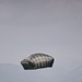 U.S. Army paratrooper descends from the sky