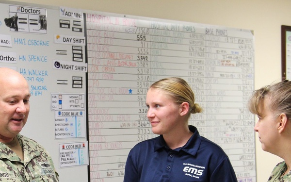 Command Triad explains Meritorious Advancement Program to Newly Promoted HM3 Gretchen Smith