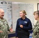 Command Triad explains Meritorious Advancement Program to Newly Promoted HM3 Gretchen Smith