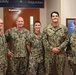 Newly Promoted HM1 Kasey Norman Stands With Command Triad and Career Counselor
