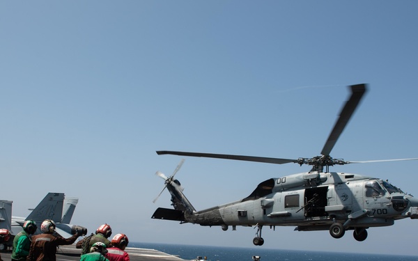 Ships from the John C. Stennis Carrier Strike Group transit the Bab al-Mandeb Strait