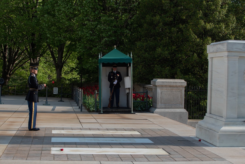 Tomb of the Unknown guard completes final walk, places a single rose at each crypt