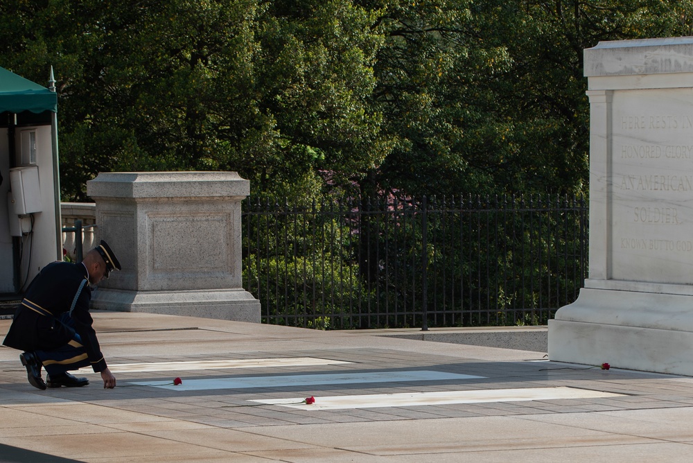 Tomb of the Unknown guard completes final walk, places a single rose at each crypt