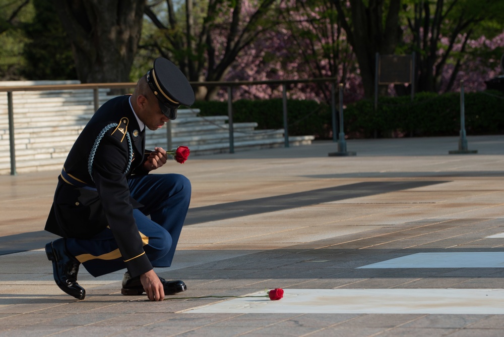 Tomb of the Unknown guard completes final walk, places a single rose at each crypt