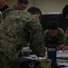 U.S. Marines work with ARDB service members at the Supporting Arms Visual Trainer