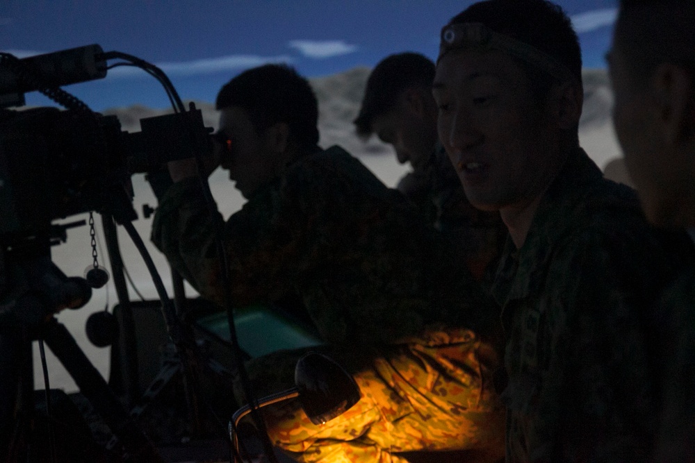 U.S. Marines work with ARDB service members at the Supporting Arms Visual Trainer