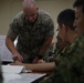 U.S. Marines work with ARDB service members at the Supporting Arms Visual Trainer