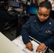 U.S. Sailor sorts through files