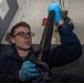 U.S. Sailor cleans a .50-caliber machine gun barrel