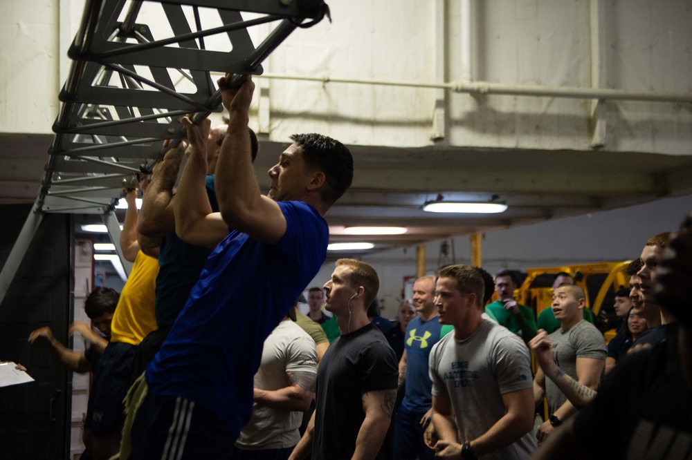 U.S. Sailor participates in a pull-up contest for a Sexual Assault Awareness and Prevention Month