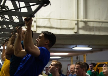 U.S. Sailor participates in a pull-up contest for a Sexual Assault Awareness and Prevention Month
