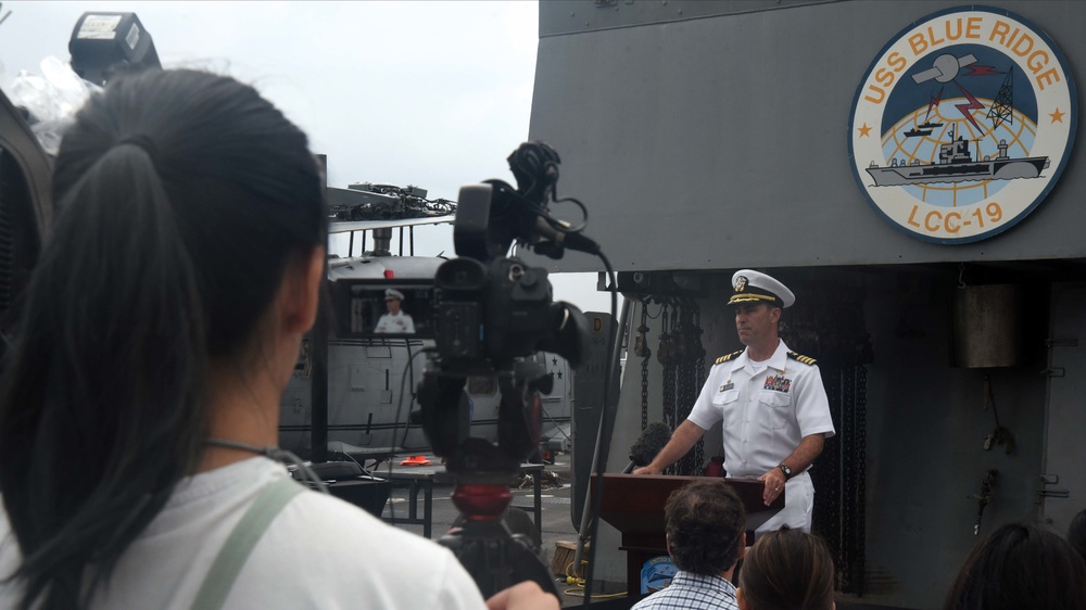 USS Blue Ridge Commanding Officer addresses Hong Kong media representatives.