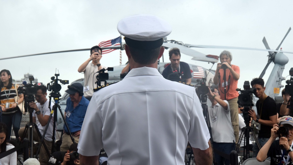 USS Blue Ridge Commanding Officer addresses Hong Kong media representatives.