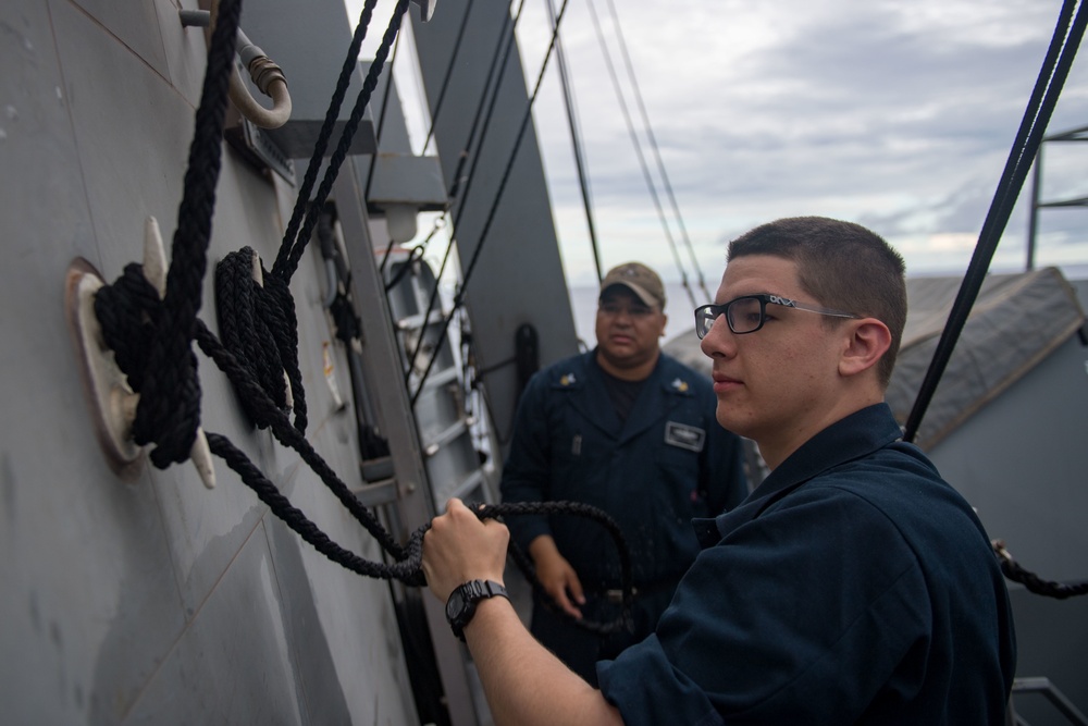 U.S. Sailor Uses Day Shape Flag for Underway Replenishment
