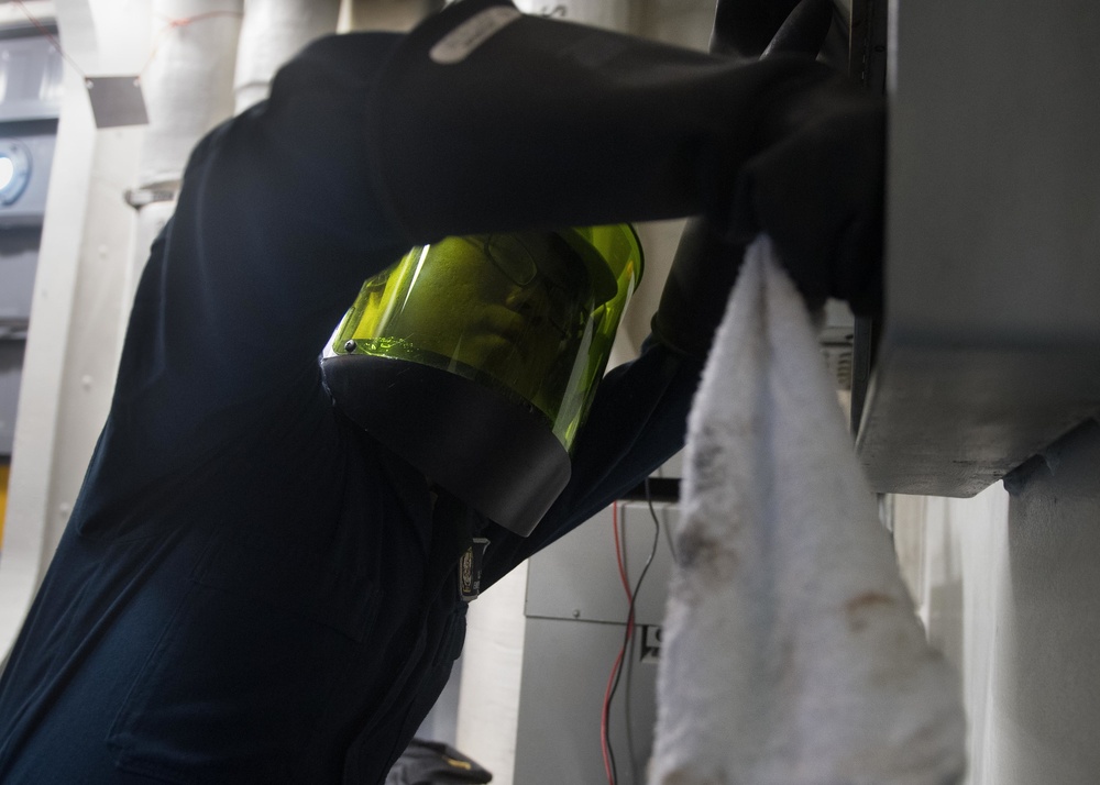 U.S. Sailor Performs Maintenance aboard USS Mobile Bay