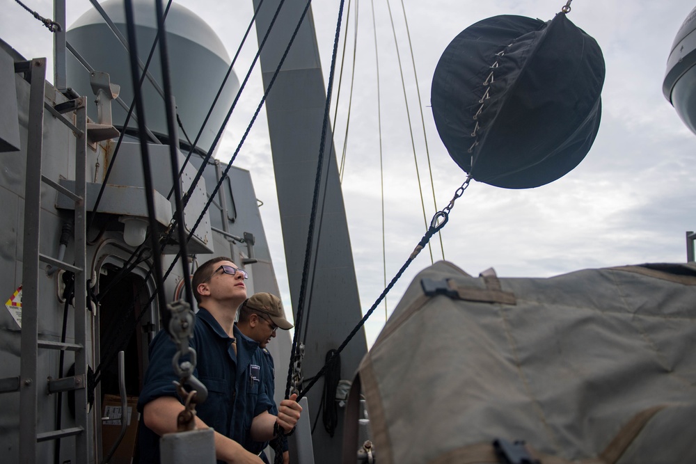 U.S. Sailor Uses Day Shape Flag for Underway Replenishment