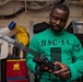 U.S. Sailor conducts maintenance on a search and rescue radio device