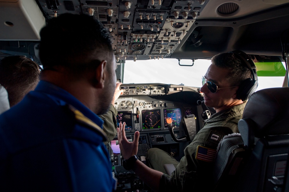 Sri Lanka military members, Commander of Navy Expeditionary Forces Command Pacific fly in a P-8 during CARAT 19