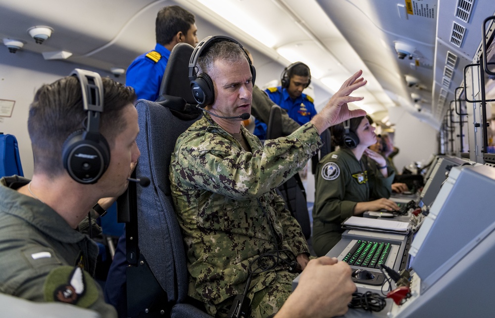 Sri Lanka military members, Commander of Navy Expeditionary Forces Command Pacific fly in a P-8 during CARAT 19