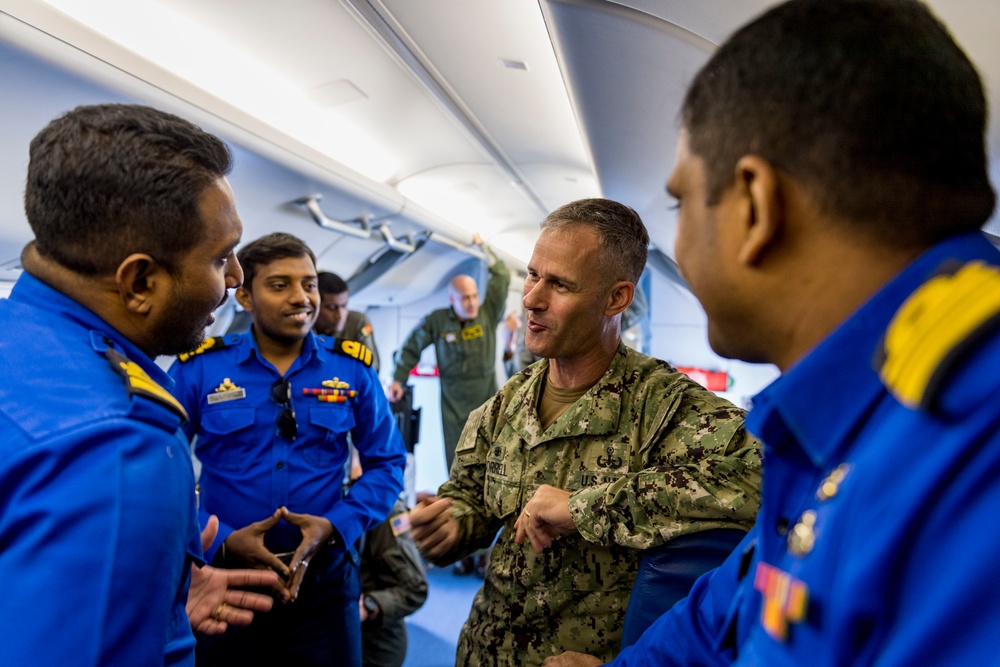 Sri Lanka military members, Commander of Navy Expeditionary Forces Command Pacific fly in a P-8 during CARAT 19