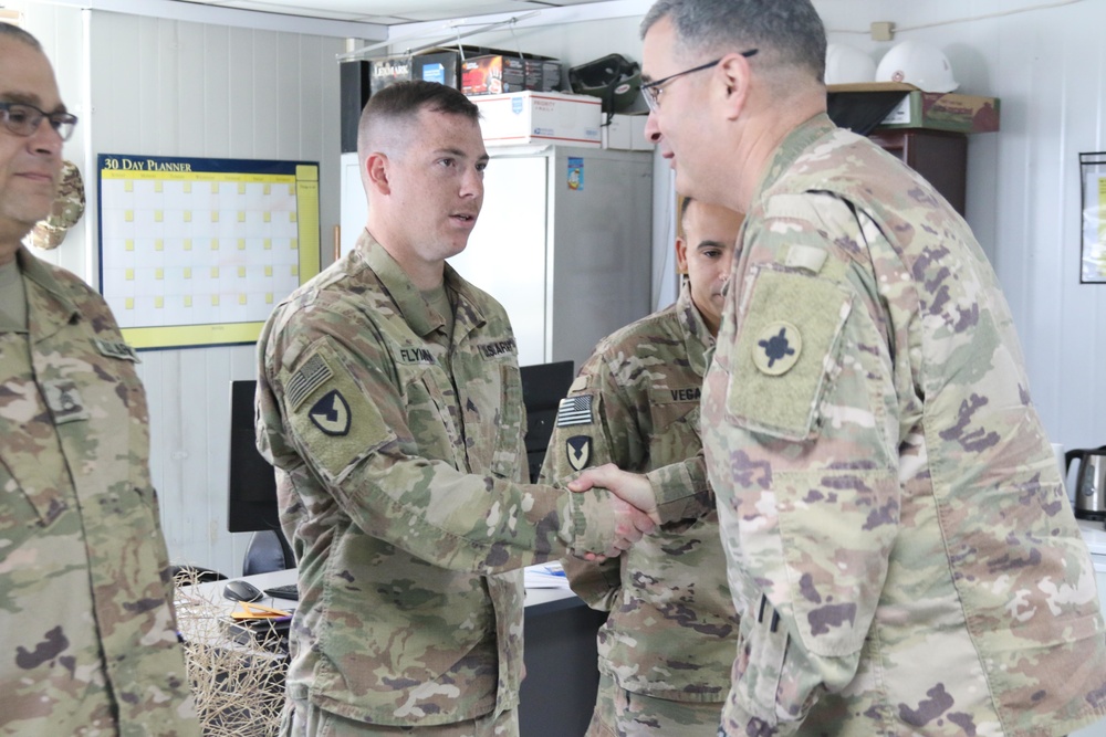 Brig. Gen. Walker Coins Soldiers For Excellence