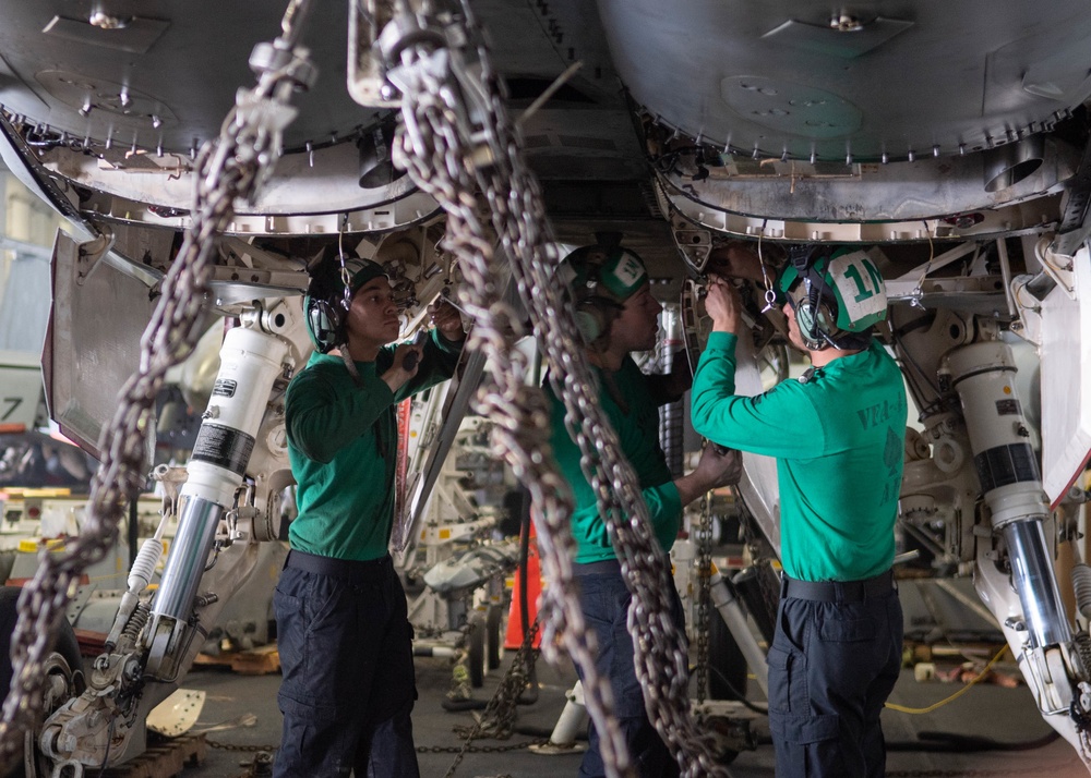 U.S. Sailors reconnect main landing gear doors